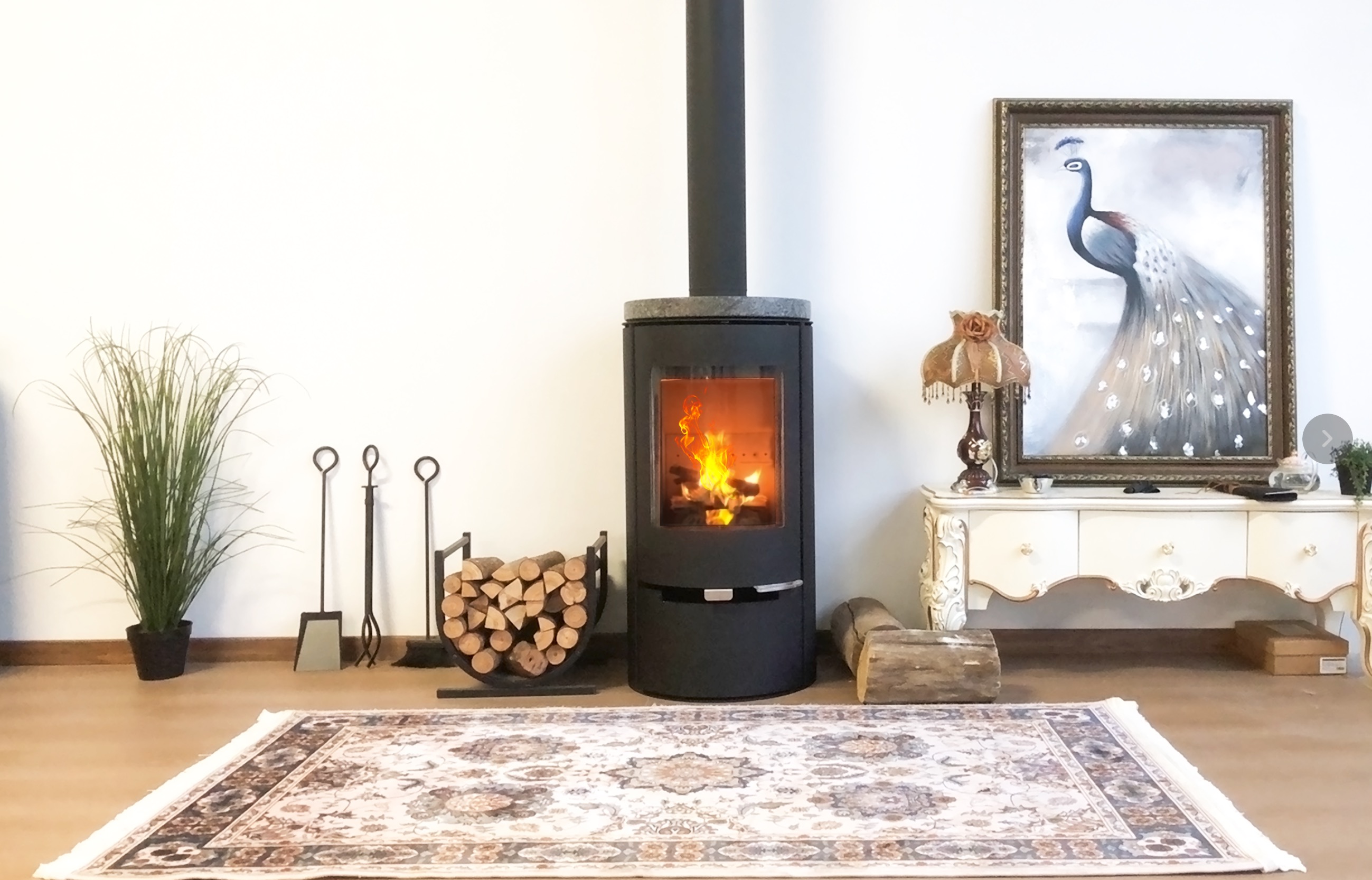 Wood burning stove with real flames warming a modern living room